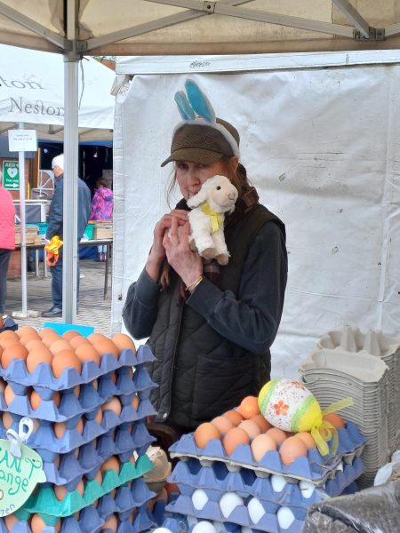 Trader with cuddly lamb